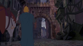 Movie still from “The Hunchback of Notre Dame” (1996), directed by Gary Trousdale – A man standing in front of an arch in a castle; Wide shot, Over the shoulder angle