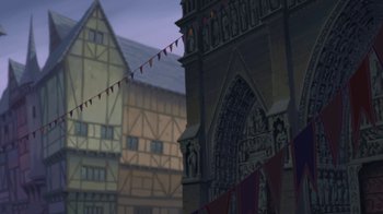 Movie still from “The Hunchback of Notre Dame” (1996), directed by Gary Trousdale – An animated picture of a building with a lot of flags hanging from it; Extreme Wide shot, Low angle
