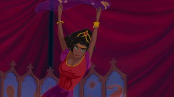 Movie still from “The Hunchback of Notre Dame” (1996), directed by Gary Trousdale – A woman in a red and purple dress holding up a purple cloth; Wide shot, Low angle