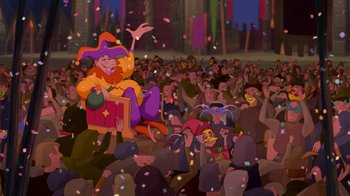 Movie still from “The Hunchback of Notre Dame” (1996), directed by Gary Trousdale – A crowd of people sitting and standing in front of a crowd; Wide shot, Low angle