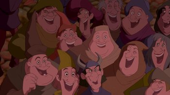 Movie still from “The Hunchback of Notre Dame” (1996), directed by Gary Trousdale – A bunch of people that are all smiling together; Medium shot, High angle
