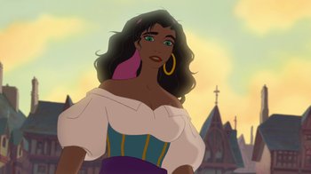 Movie still from “The Hunchback of Notre Dame” (1996), directed by Gary Trousdale – A woman with long black curly hair wearing a white top; Medium shot, Low angle