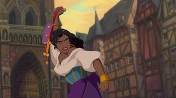 Movie still from “The Hunchback of Notre Dame” (1996), directed by Gary Trousdale – A woman in a purple and yellow dress holding a red object; Medium shot, Low angle