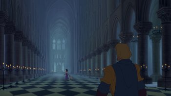 Movie still from “The Hunchback of Notre Dame” (1996), directed by Gary Trousdale – A man and a woman are walking through a cathedral; Extreme Wide shot, Over the shoulder angle