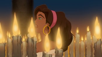 Movie still from “The Hunchback of Notre Dame” (1996), directed by Gary Trousdale – A woman's face in front of candles; Close Up shot, Over the shoulder angle