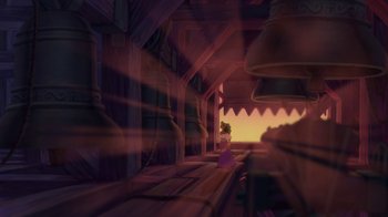 Movie still from “The Hunchback of Notre Dame” (1996), directed by Gary Trousdale – A little girl is standing in front of some bells; Extreme Wide shot, Low angle