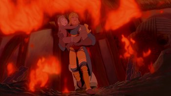 Movie still from “The Hunchback of Notre Dame” (1996), directed by Gary Trousdale – A man holding a woman while standing in front of fire; Wide shot, Low angle