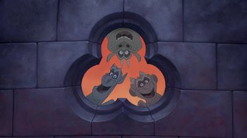 Movie still from “The Hunchback of Notre Dame” (1996), directed by Gary Trousdale – Three cartoon characters are in the center of a wall; Wide shot, Low angle