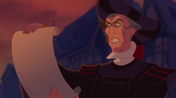 Movie still from “The Hunchback of Notre Dame” (1996), directed by Gary Trousdale – A man in a hat is looking at a paper; Close Up shot, Over the shoulder angle