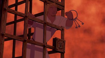 Movie still from “The Hunchback of Notre Dame” (1996), directed by Gary Trousdale – A man holding a bunch of keys while standing in a jail cell; Medium shot, High angle