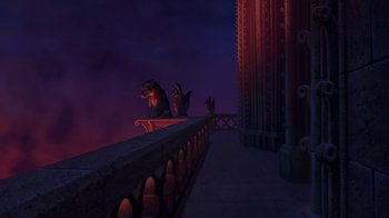 Movie still from “The Hunchback of Notre Dame” (1996), directed by Gary Trousdale – A couple of animals sitting on top of a railing; Extreme Wide shot, Low angle