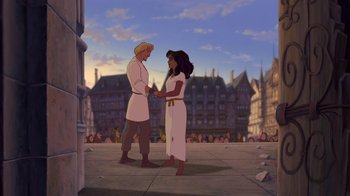 Movie still from “The Hunchback of Notre Dame” (1996), directed by Gary Trousdale – A man and a woman holding hands in front of a building; Wide shot, High angle
