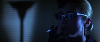 Movie still from “The Hunger” (1983), directed by Tony Scott – A woman with a cigarette in her mouth; Close Up shot, Low angle