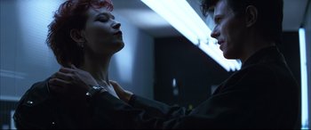 Movie still from “The Hunger” (1983), directed by Tony Scott – A man and a woman are dancing in a dark room; Close Up shot, Low angle