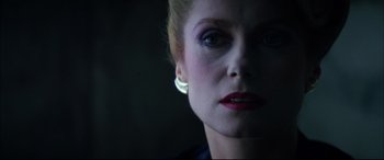 Movie still from “The Hunger” (1983), directed by Tony Scott – A person wearing a black shirt; Close Up shot, Low angle