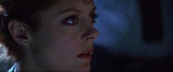 Movie still from “The Hunger” (1983), directed by Tony Scott – A woman's face in the dark; Close Up shot, Low angle