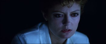 Movie still from “The Hunger” (1983), directed by Tony Scott – A woman's face in the dark; Close Up shot, Low angle