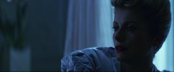 Movie still from “The Hunger” (1983), directed by Tony Scott – A woman's face in the dark; Close Up shot, Low angle