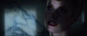 Movie still from “The Hunger” (1983), directed by Tony Scott – A woman's face in the dark; Close Up shot, Over the shoulder angle