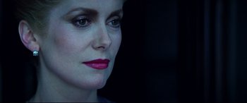 Movie still from “The Hunger” (1983), directed by Tony Scott – A person with lipstick on their lips; Close Up shot, Over the shoulder angle