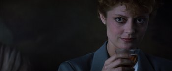 Movie still from “The Hunger” (1983), directed by Tony Scott – A person with a hand on her chin; Close Up shot, Over the shoulder angle