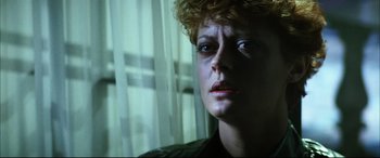 Movie still from “The Hunger” (1983), directed by Tony Scott – A person looking at the camera; Close Up shot, Low angle