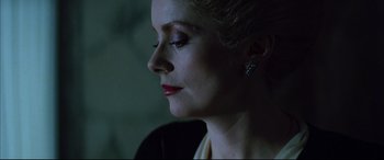 Movie still from “The Hunger” (1983), directed by Tony Scott – A person wearing a dress; Close Up shot, Low angle
