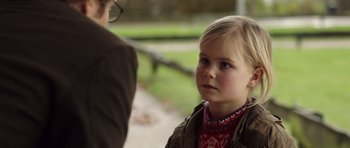 Movie still from “The Hunt” (2012), directed by Thomas Vinterberg – A little girl standing next to an older woman; Close Up shot, Over the shoulder angle