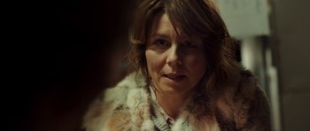 Movie still from “The Hunt” (2012), directed by Thomas Vinterberg – A person wearing a fur coat; Close Up shot, Over the shoulder angle