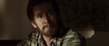 Movie still from “The Hunt” (2012), directed by Thomas Vinterberg – A person wearing a plaid shirt; Close Up shot, Over the shoulder angle