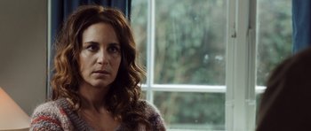 Movie still from “The Hunt” (2012), directed by Thomas Vinterberg – A person near a window; Close Up shot, Over the shoulder angle