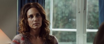 Movie still from “The Hunt” (2012), directed by Thomas Vinterberg – A person with long brown hair; Close Up shot, Over the shoulder angle