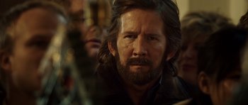 Movie still from “The Hunt” (2012), directed by Thomas Vinterberg – A person with long hair and a beard; Close Up shot, Over the shoulder angle