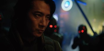 Movie still from “Altered Carbon” (2018), created by Laeta Kalogridis – A person wearing a hat; Close Up shot, Over the shoulder angle