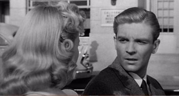 Movie still from “The Incredible Shrinking Man” (1957), directed by Jack Arnold – A man and a woman talking to each other; Close Up shot, Over the shoulder angle