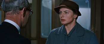 Movie still from “The Inn of the Sixth Happiness” (1958), directed by Mark Robson – A person wearing a hat; Close Up shot, Over the shoulder angle