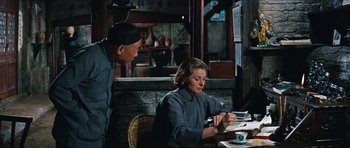 Movie still from “The Inn of the Sixth Happiness” (1958), directed by Mark Robson – A man and a woman sitting at a table in a restaurant; Medium shot, Over the shoulder angle