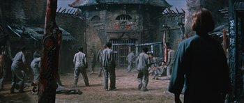Movie still from “The Inn of the Sixth Happiness” (1958), directed by Mark Robson – A group of men standing in front of a building; Extreme Wide shot, High angle
