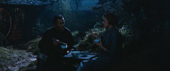 Movie still from “The Inn of the Sixth Happiness” (1958), directed by Mark Robson – A man and a woman sitting at a dinner table; Medium shot, High angle