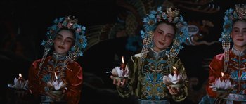 Movie still from “The Inn of the Sixth Happiness” (1958), directed by Mark Robson – Two women in traditional chinese dress holding candles; Medium shot, Low angle