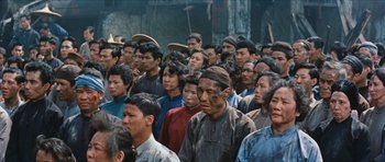 Movie still from “The Inn of the Sixth Happiness” (1958), directed by Mark Robson – A large group of people standing together in a crowd; Medium shot, High angle