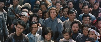 Movie still from “The Inn of the Sixth Happiness” (1958), directed by Mark Robson – A group of men and women standing in a crowd; Medium shot, High angle