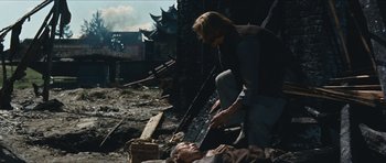 Movie still from “The Inn of the Sixth Happiness” (1958), directed by Mark Robson – A man is standing over a dead body; Wide shot, High angle