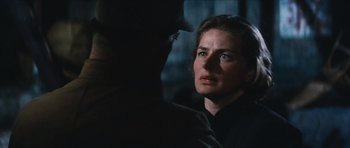 Movie still from “The Inn of the Sixth Happiness” (1958), directed by Mark Robson – A woman looking at a man in a dark room; Close Up shot, Over the shoulder angle