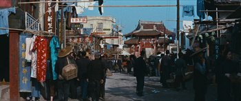 Movie still from “The Inn of the Sixth Happiness” (1958), directed by Mark Robson – A crowd of people walking down a street; Extreme Wide shot, High angle