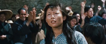 Movie still from “The Inn of the Sixth Happiness” (1958), directed by Mark Robson – A woman with long black hair is looking up; Close Up shot, Low angle