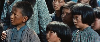 Movie still from “The Inn of the Sixth Happiness” (1958), directed by Mark Robson – A group of people standing next to each other; Close Up shot, High angle