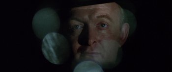 Movie still from “The Ipcress File” (1965), directed by Sidney J. Furie – A man's face in the dark; Close Up shot, Low angle
