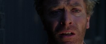 Movie still from “The Ipcress File” (1965), directed by Sidney J. Furie – A man's face in the dark; Close Up shot, Low angle