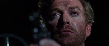 Movie still from “The Ipcress File” (1965), directed by Sidney J. Furie – A person looking at the camera; Close Up shot, Over the shoulder angle